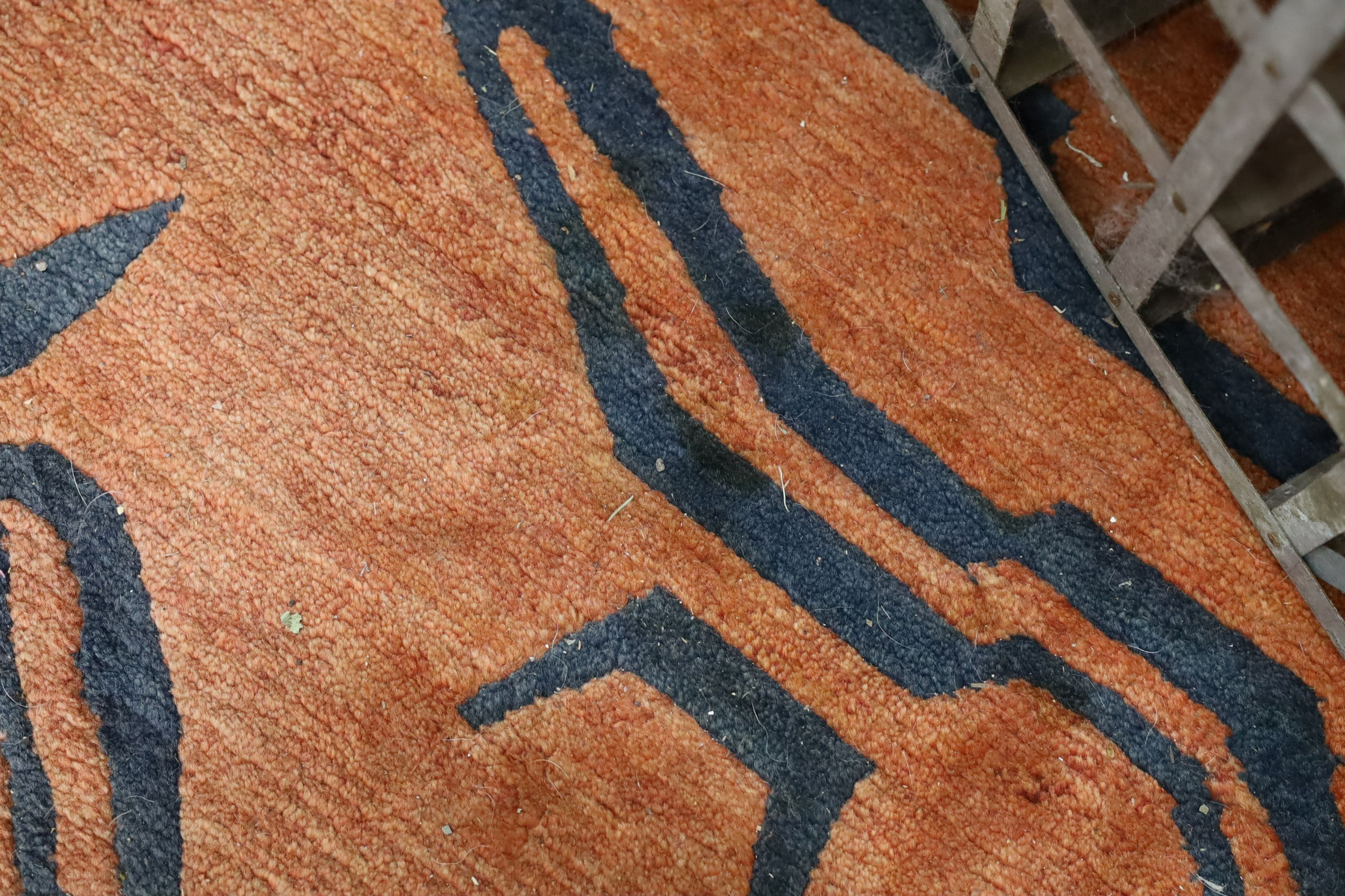 A contemporary red ground zebra striped carpet, 340 x 230cm